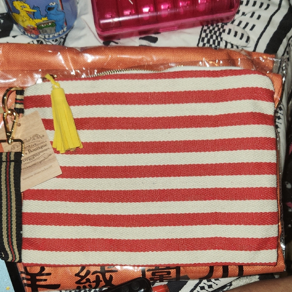 Chic Striped Clutch with Yellow Tassel